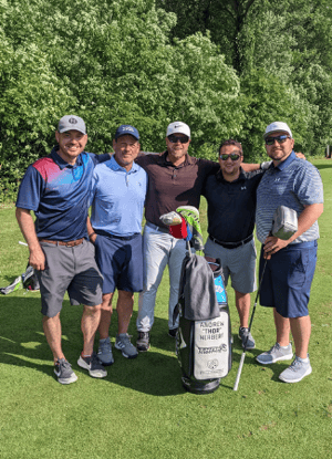 Fund That Flip employees and clients at a golf tournament.